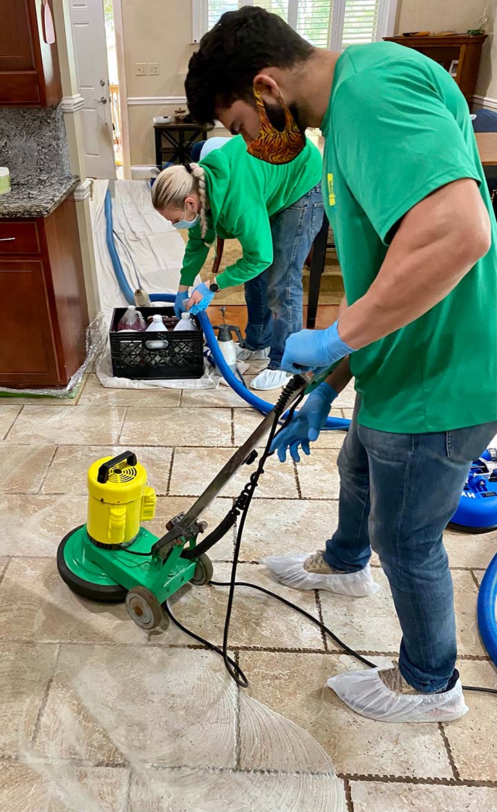 A1 Sparkles technicians cleaning kitchen tile and grout